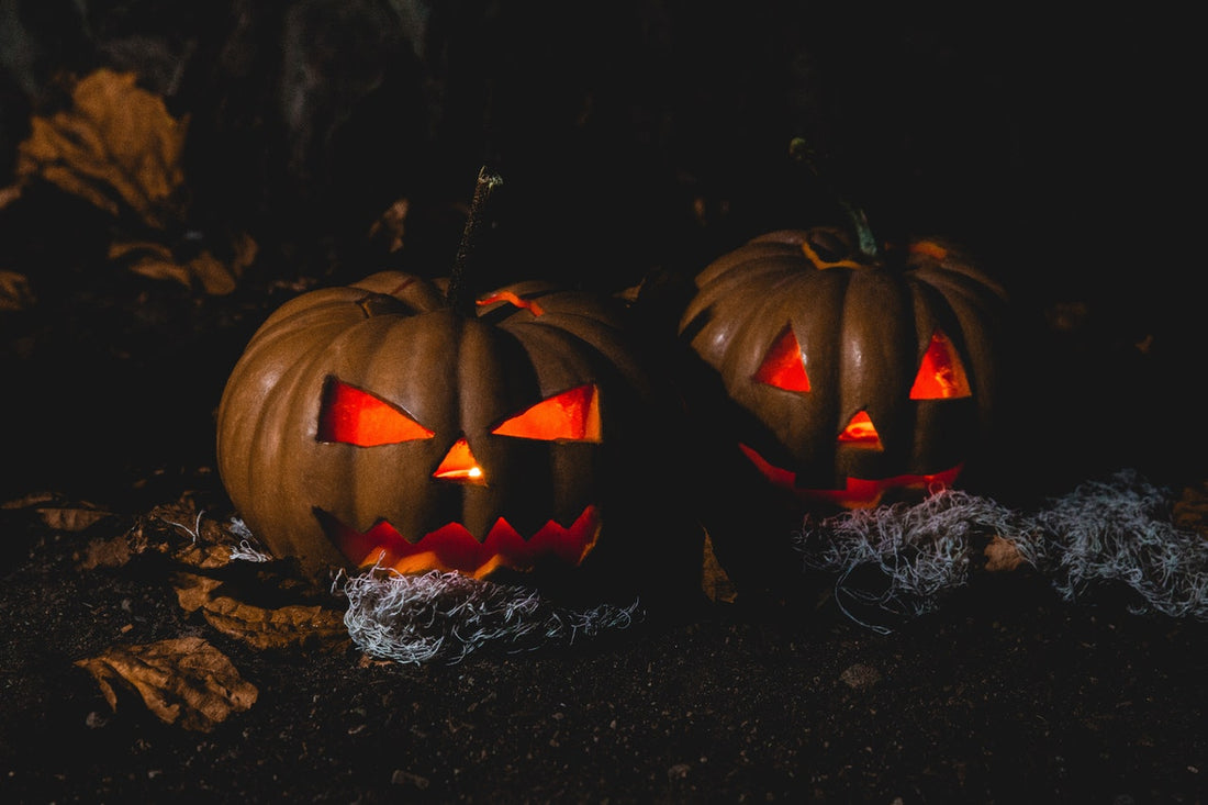 Two Halloween pumpkins with light